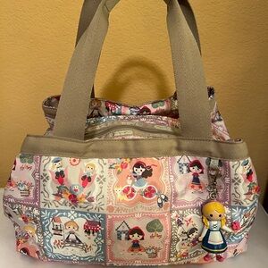Lesportsac Disney Small World “Well Wishes” Molly bag with doll